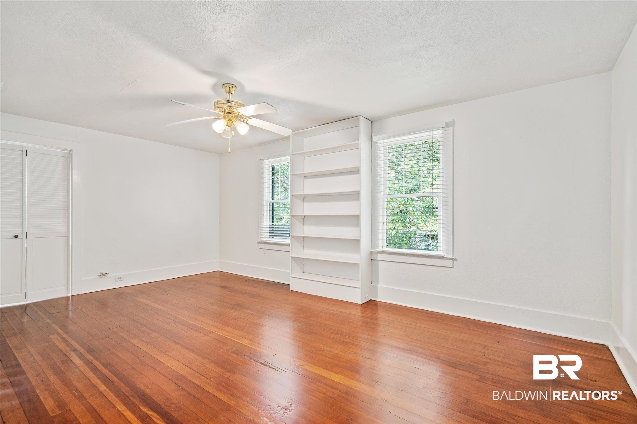 1159 Palmetto Street Mobile, AL 36604 - Photo 14 of 21 Spare room with wood-type flooring and ceiling fan