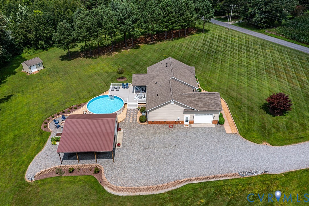 184 Crosshills Road Heathsville, VA 22473 - Photo 20 of 44 Expansive gravel driveway leading to a multi-car c
