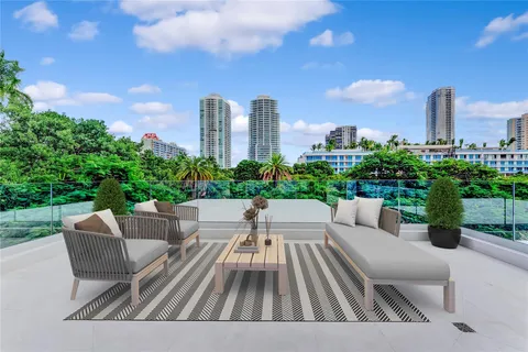 a view of a patio with couches chairs and a big yard