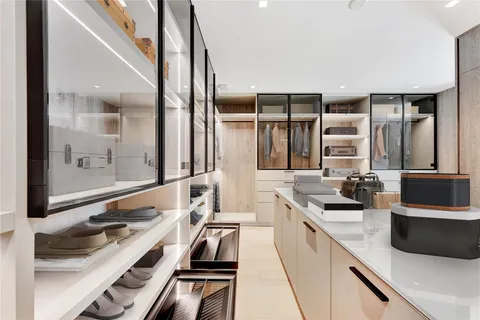 a bedroom with a large bed and a large window