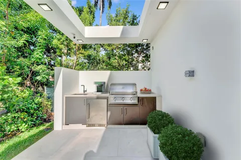 a view of a pathway both side of a house