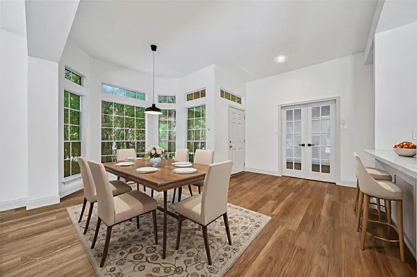 a dining room with furniture window wooden floor