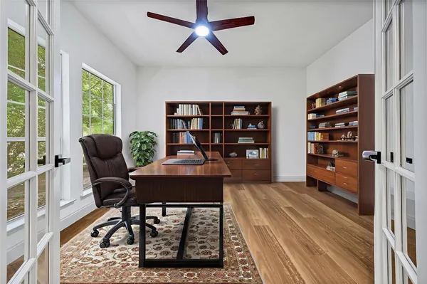 a workspace with furniture and a book shelf
