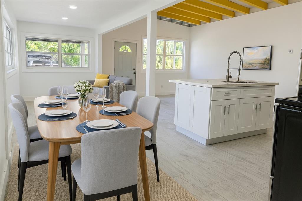 821 North B Street Lake Worth Beach, FL 33460 - Photo 2 of 9 a dining room with furniture a window and wood floor