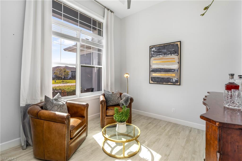29 Johnnycake Drive Naples, FL 34110 - Photo 15 of 42 a living room with furniture and a window