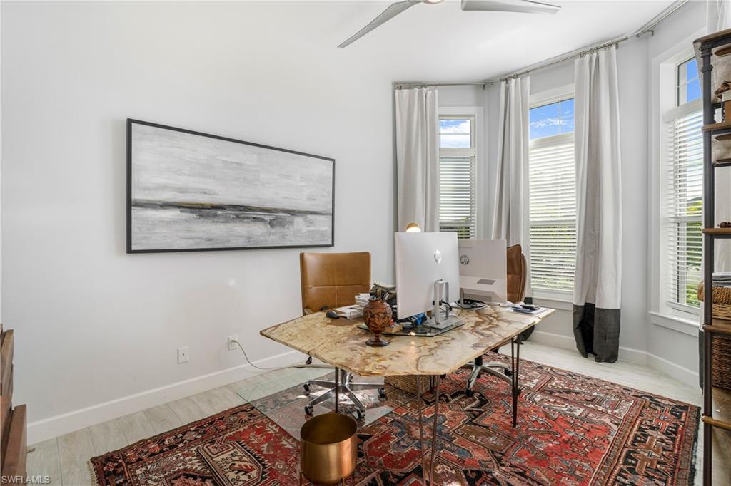 29 Johnnycake Drive Naples, FL 34110 - Photo 16 of 42 a view of a workspace with furniture and window