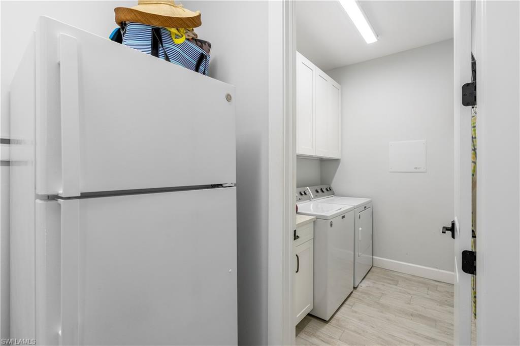 29 Johnnycake Drive Naples, FL 34110 - Photo 26 of 42 a kitchen with a refrigerator and a stove