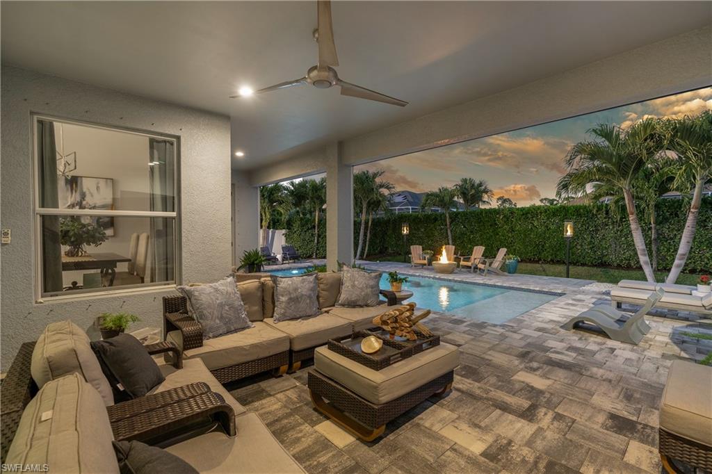 29 Johnnycake Drive Naples, FL 34110 - Photo 29 of 42 a living room with furniture and a large window