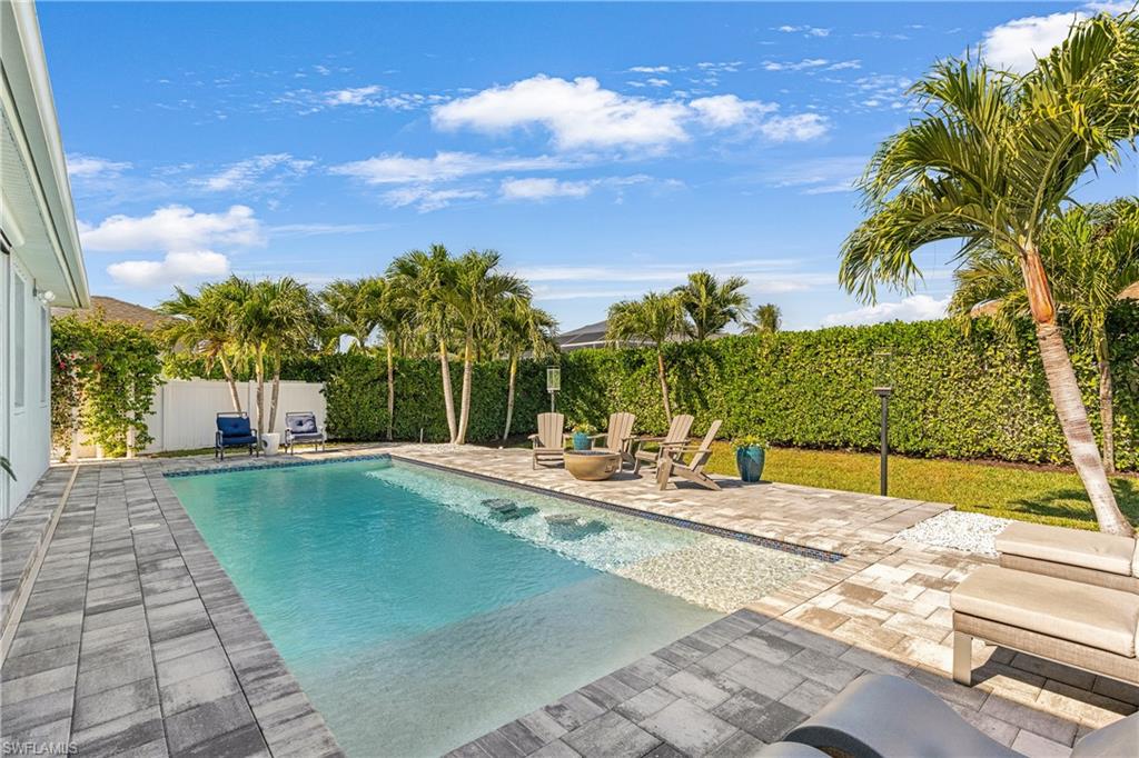 29 Johnnycake Drive Naples, FL 34110 - Photo 31 of 42 a view of swimming pool with a yard