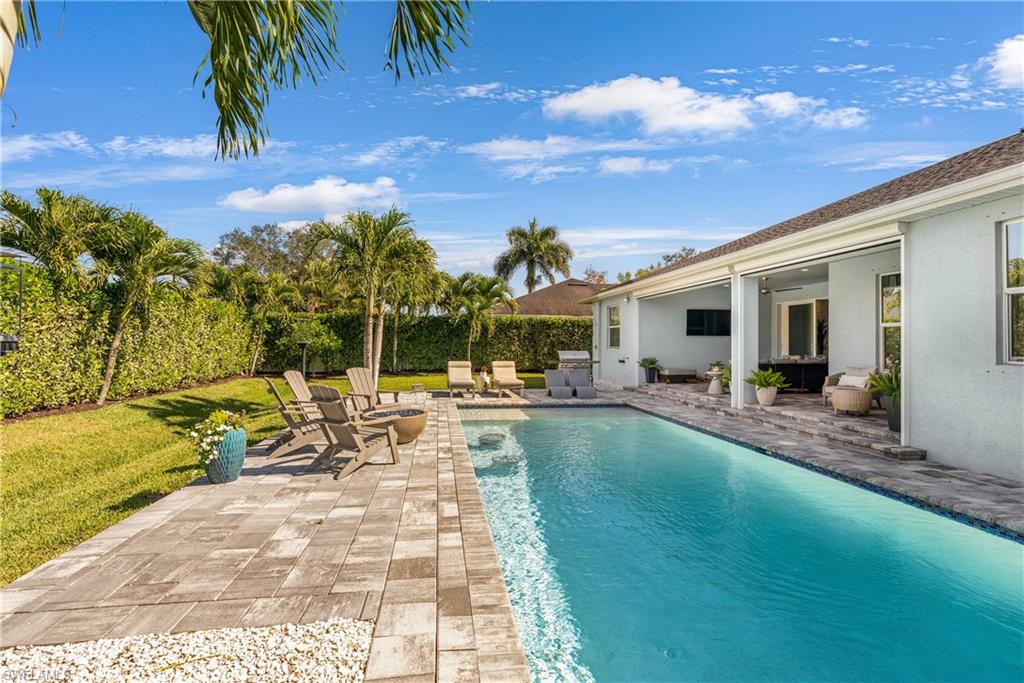 29 Johnnycake Drive Naples, FL 34110 - Photo 34 of 42 a view of a backyard with a patio