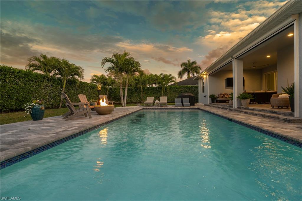 29 Johnnycake Drive Naples, FL 34110 - Photo 35 of 42 a view of a swimming pool with a patio