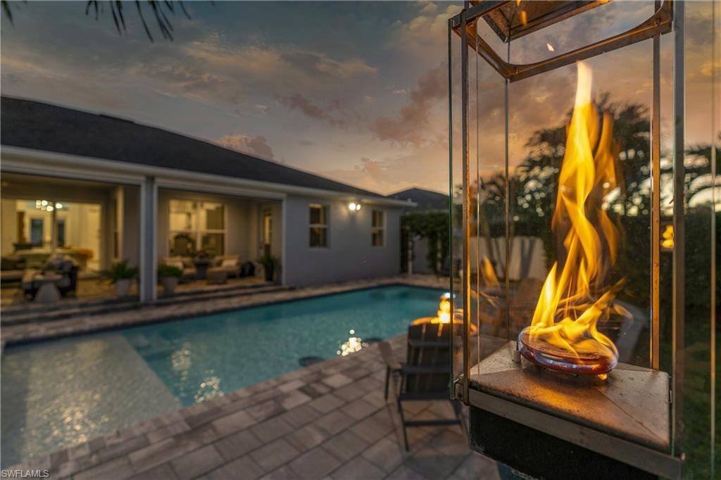 29 Johnnycake Drive Naples, FL 34110 - Photo 36 of 42 a view of swimming pool with outdoor seating