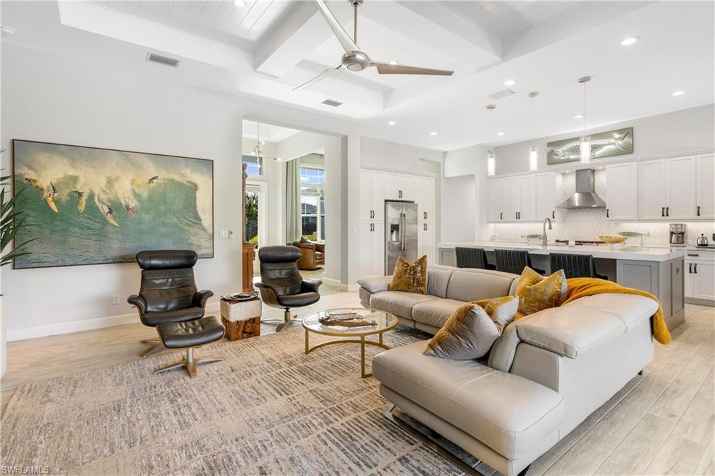 29 Johnnycake Drive Naples, FL 34110 - Photo 8 of 42 a living room with furniture and a large window