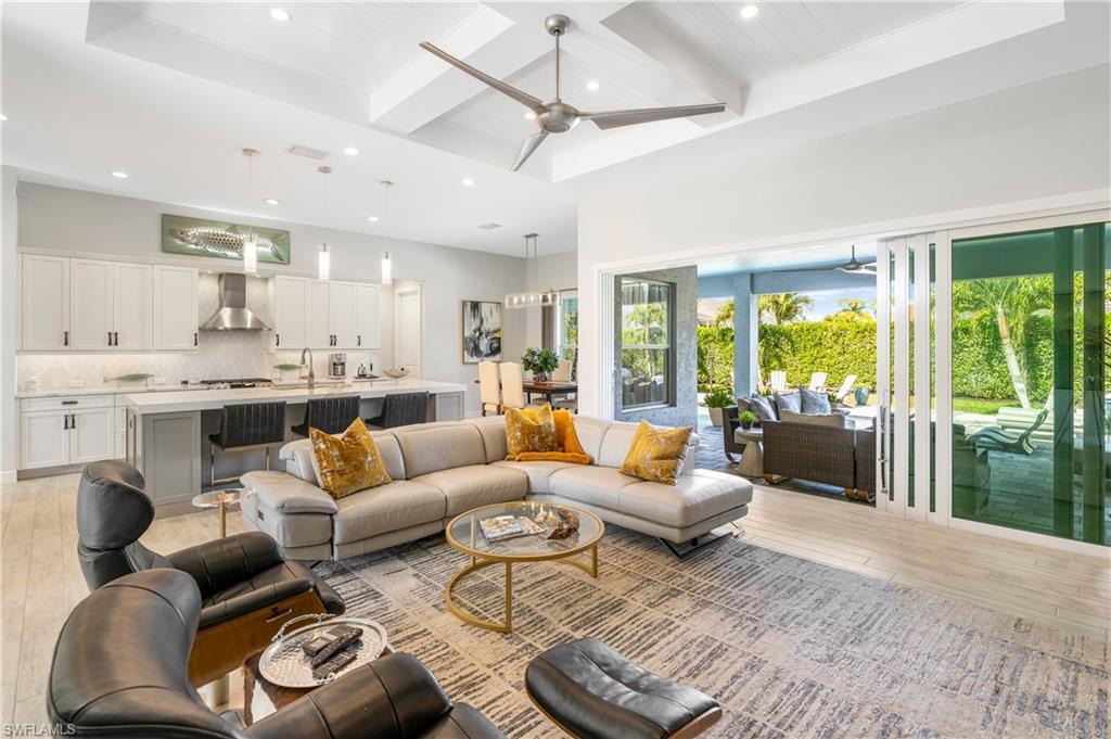 29 Johnnycake Drive Naples, FL 34110 - Photo 9 of 42 a living room with furniture and a large window