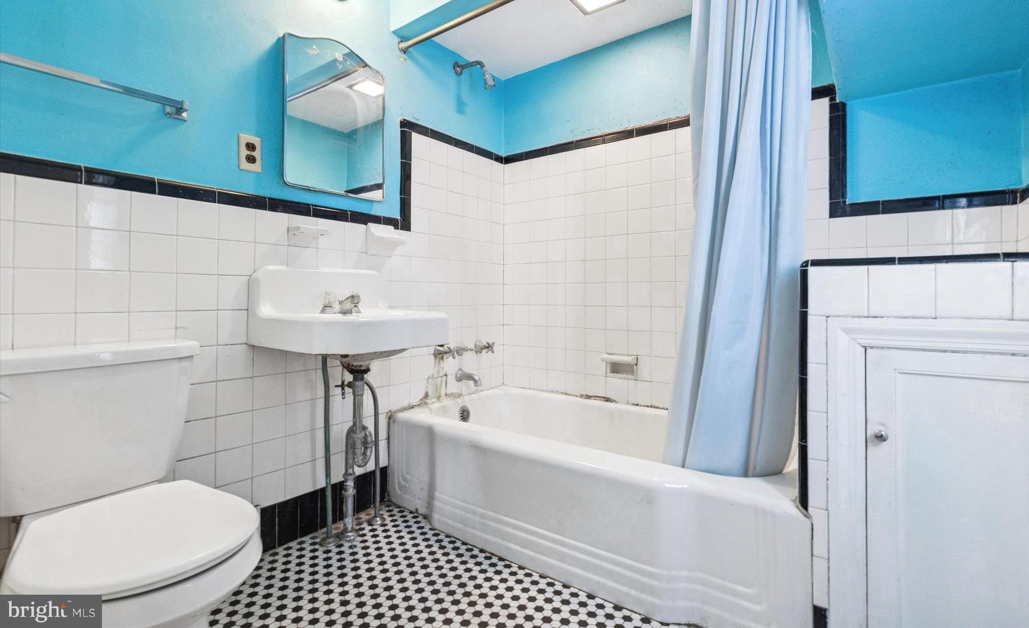 219 Williamsburg Road Ardmore, PA 19003 - Photo 12 of 14 a bathroom with a sink a toilet and shower
