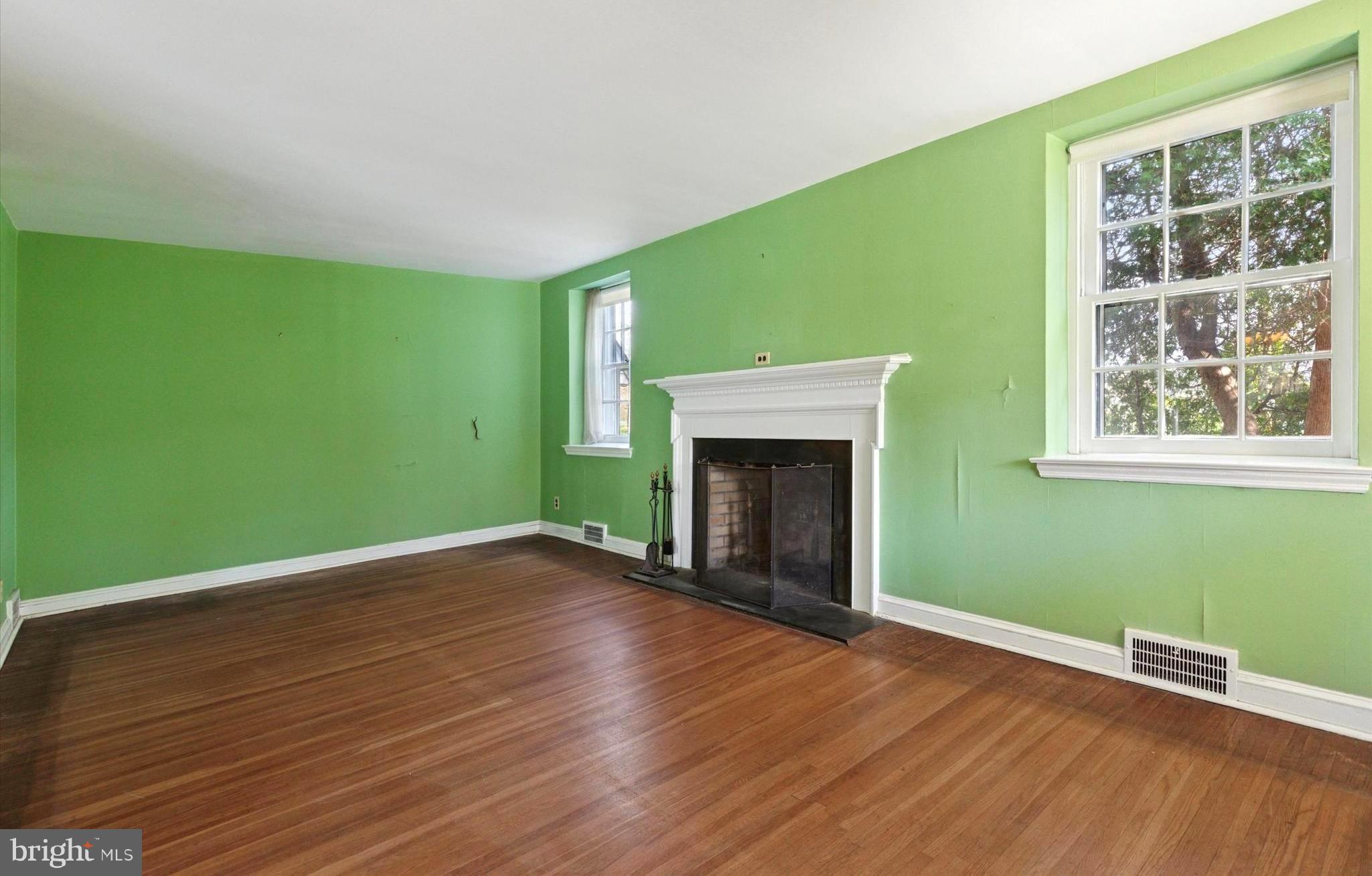 219 Williamsburg Road Ardmore, PA 19003 - Photo 4 of 14 a view of empty room with wooden floor and fan