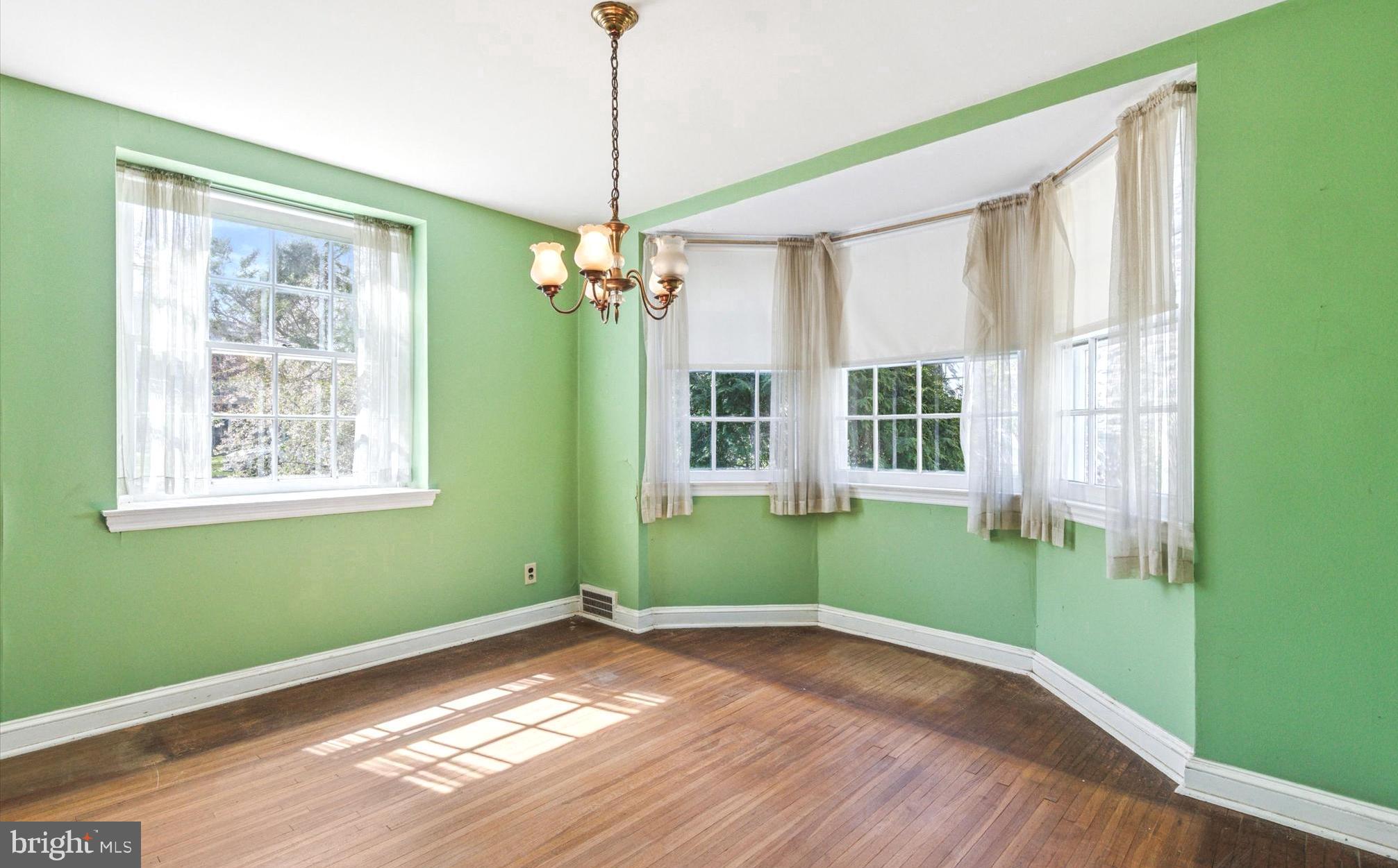 219 Williamsburg Road Ardmore, PA 19003 - Photo 6 of 14 a view of empty room with window and hardwood