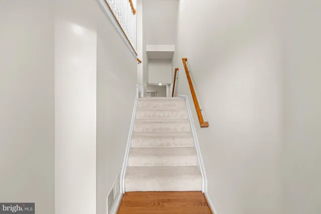 a view of staircase with white walls