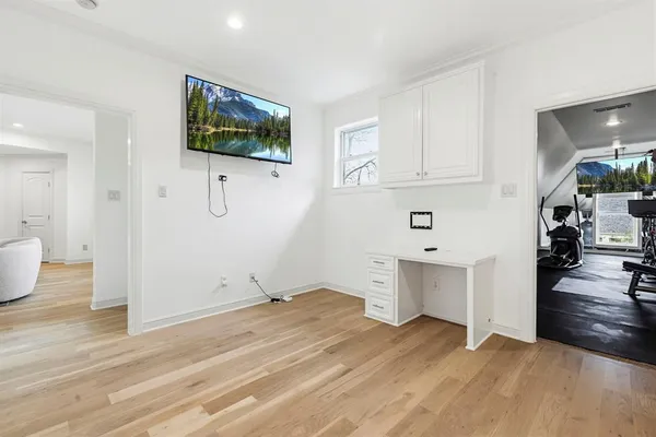 a view of kitchen with furniture and wooden floor