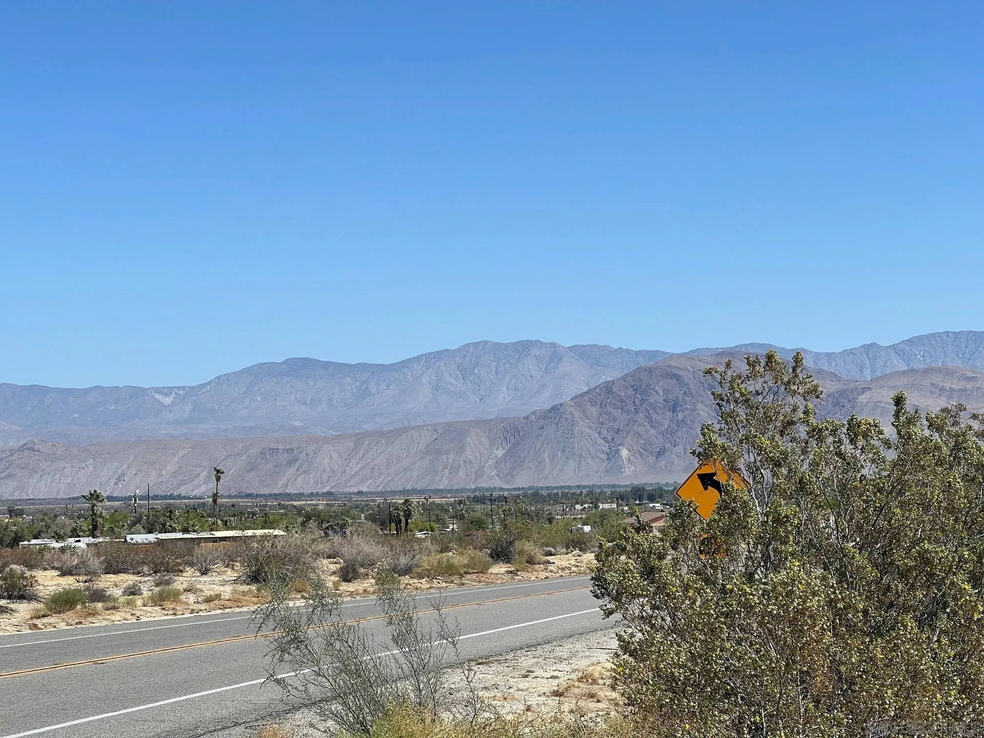 Borrego Springs Road, Unit 131 Borrego Springs, CA 92004 - Photo 4 of 10 a view of a house with a yard and a car park side of it