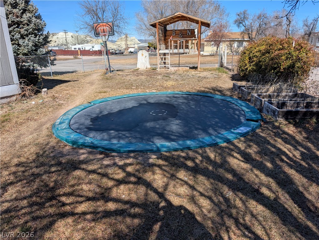 320 6th Street Panaca, NV 89042 - Photo 27 of 30 View of yard featuring an in-ground trampoline