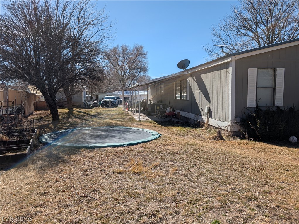 320 6th Street Panaca, NV 89042 - Photo 28 of 30 View of yard featuring a patio
