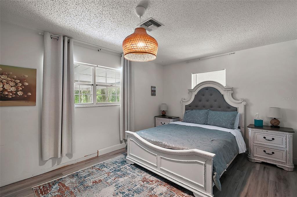 705 West Summit Court Mount Dora, FL 32757 - Photo 23 of 37 a bedroom with a bed and a window