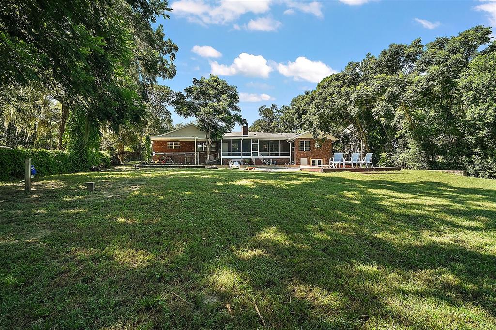 705 West Summit Court Mount Dora, FL 32757 - Photo 34 of 37 a view of a house with a big yard