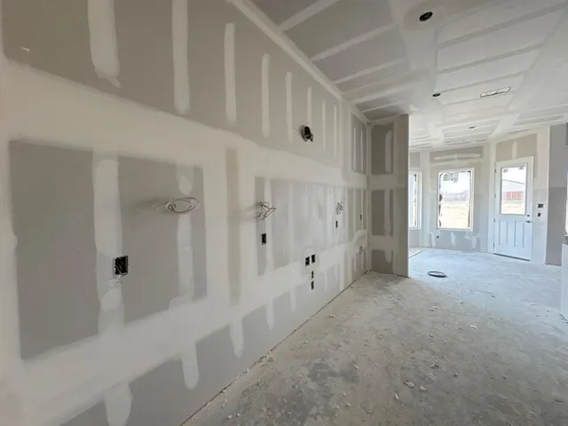 a view of a hallway with white walls