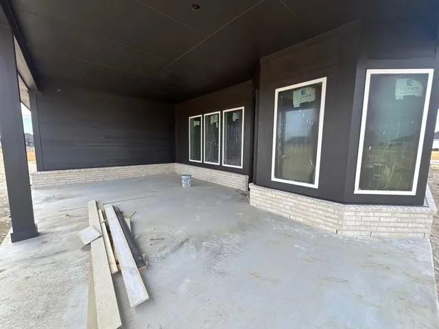 a view of an empty room with windows