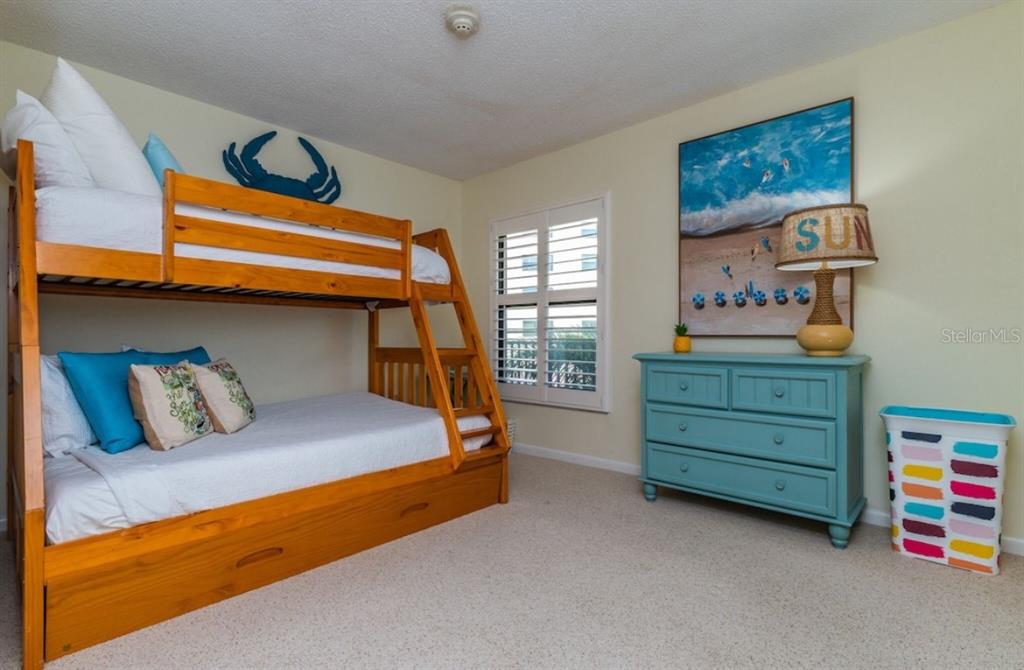 6480 Midnight Pass Road, Unit 316 Sarasota, FL 34242 - Photo 17 of 23 2nd Bedroom with bunk beds