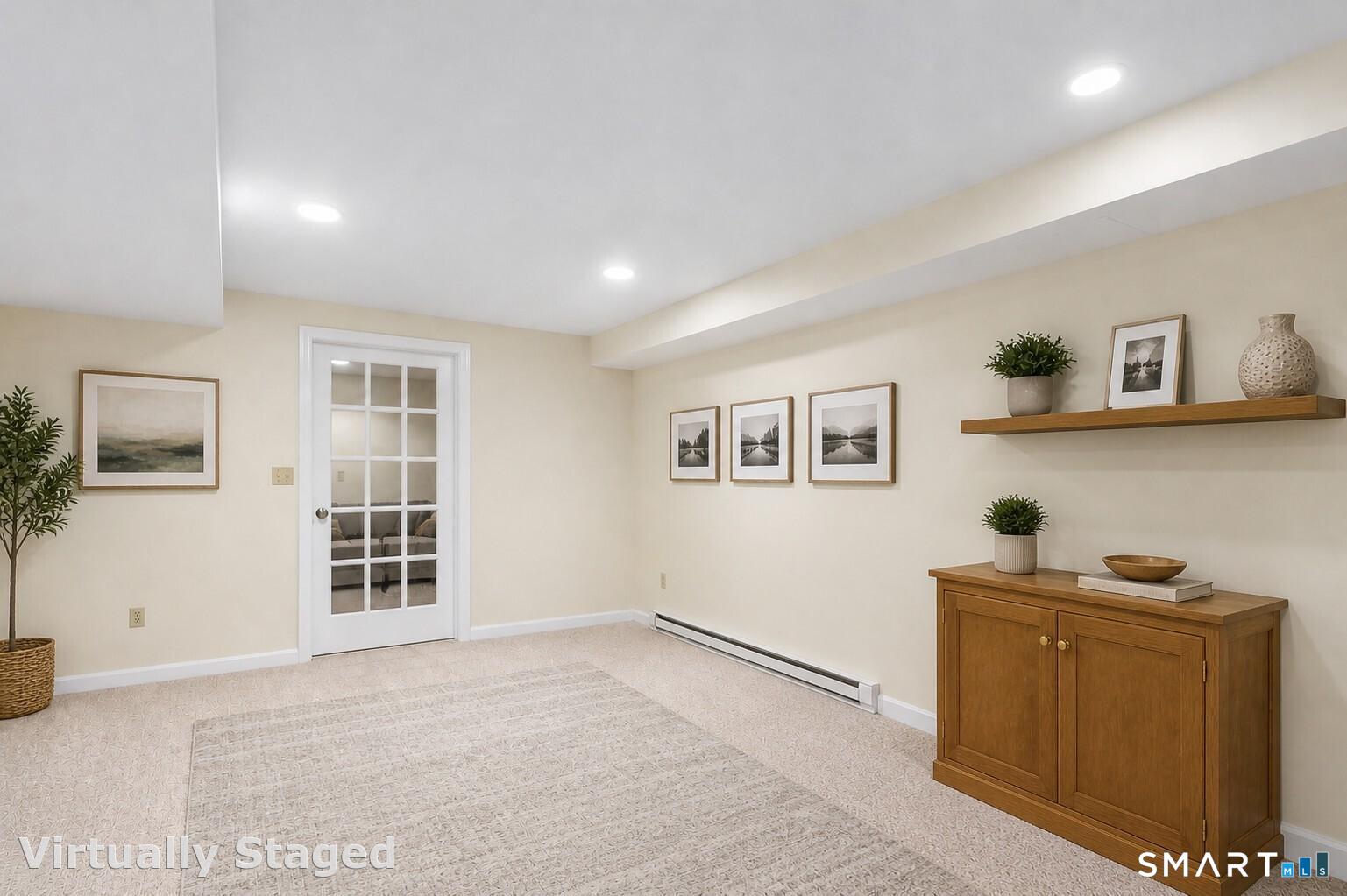 45 Beardsley Road New Milford, CT 06776 - Photo 32 of 40 The fully finished basement offers even more versatility, ideal for recreation, work, or entertaining, including a half bath along with ample storage.