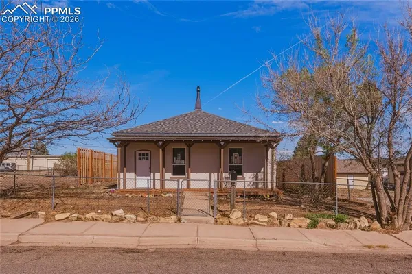 a front view of a house with garage
