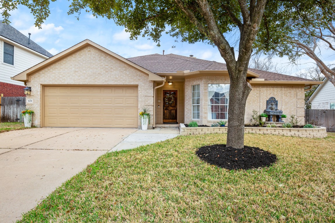 808 Point Run Drive Pflugerville, TX 78660 - Photo 1 of 1 a front view of a house with a yard and garage