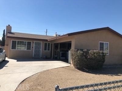 1840 Armory Road Barstow, CA 92311 - Photo 1 of 1 a front view of a house with a garden
