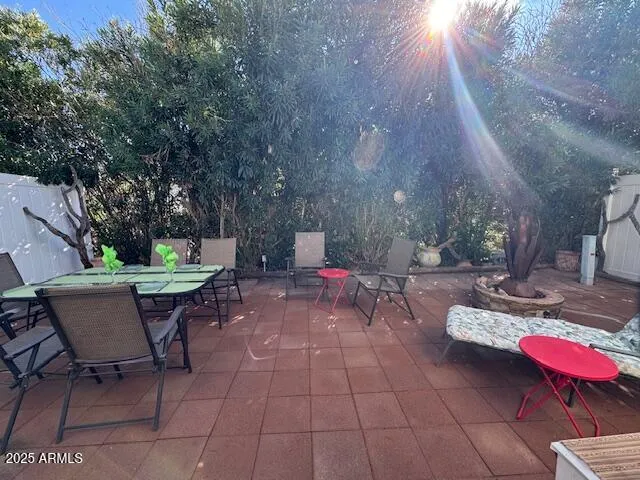 a view of a backyard with sitting area