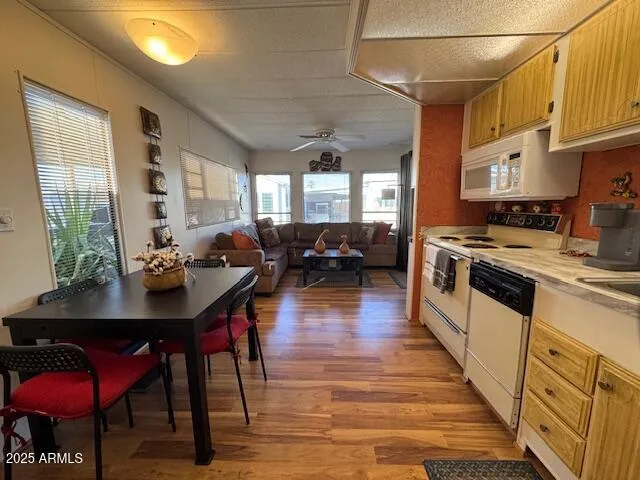 a kitchen with stainless steel appliances granite countertop a stove a sink dishwasher a microwave oven with granite countertops and cabinets