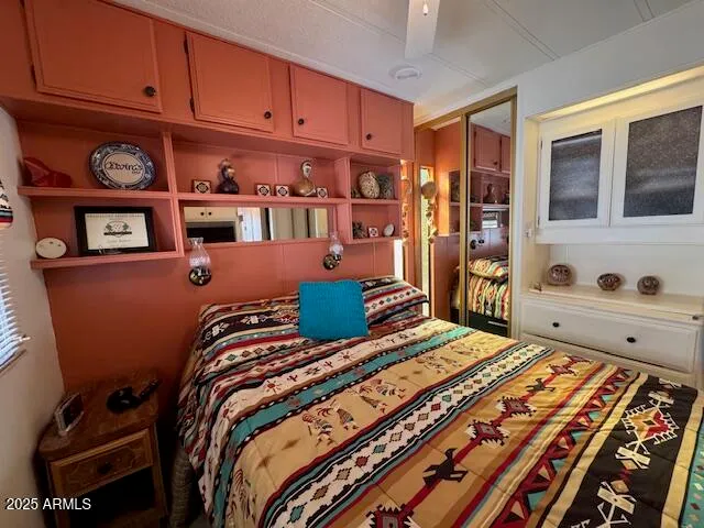 a bedroom with a bed and a closet