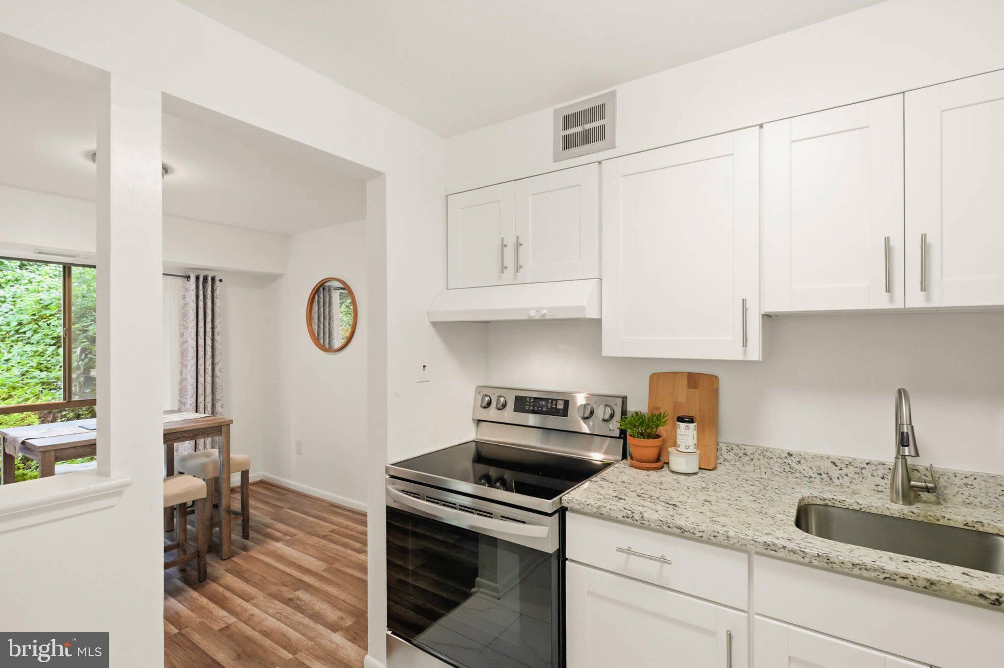 17816 Buehler Road, Unit 1B1 164 Olney, MD 20832 - Photo 11 of 29 Modern kitchen with natural light.