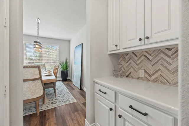 a view of room with furniture and wooden floor