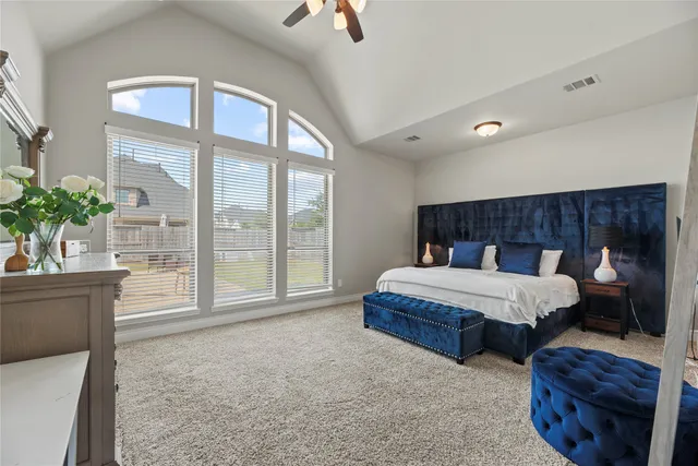 a bedroom with bed and balcony