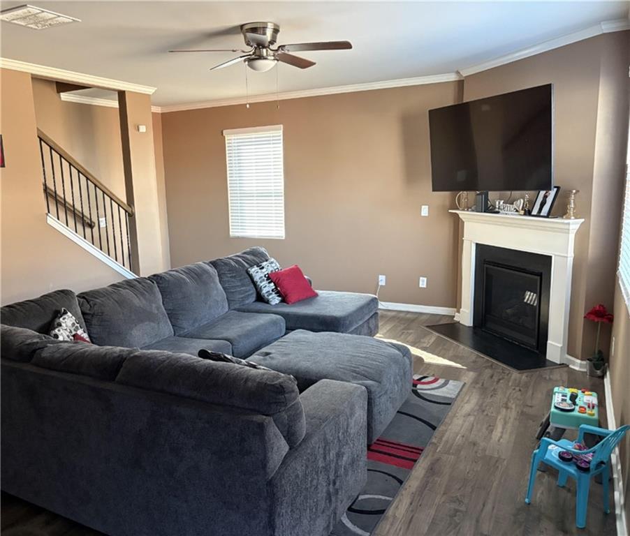 4475 Merrigold Way Fairburn, GA 30213 - Photo 2 of 22 a living room with furniture a flat screen tv and a fireplace