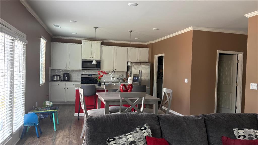 4475 Merrigold Way Fairburn, GA 30213 - Photo 4 of 22 a living room with furniture and a flat screen tv