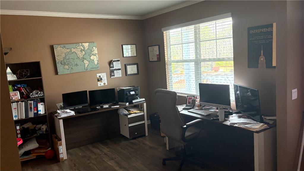 4475 Merrigold Way Fairburn, GA 30213 - Photo 7 of 22 a view of a workspace with furniture and a window
