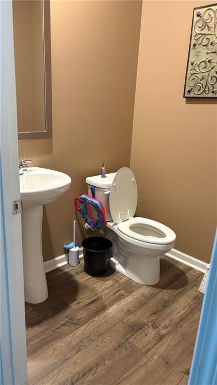 4475 Merrigold Way Fairburn, GA 30213 - Photo 8 of 22 a bathroom with a toilet and a sink