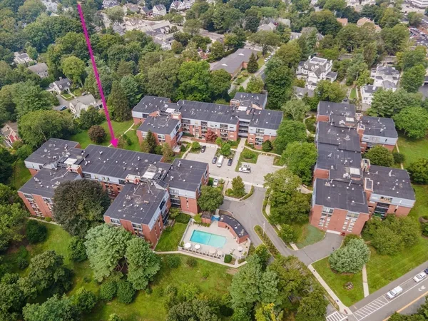 an aerial view of house with yard swimming pool and outdoor seating