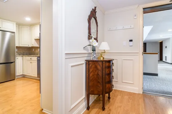 a view of kitchen with furniture and refrigerator