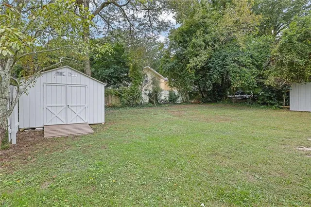 a view of a backyard of the house