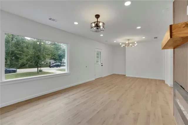 a view of an empty room with a window