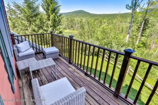 a view of balcony with furniture